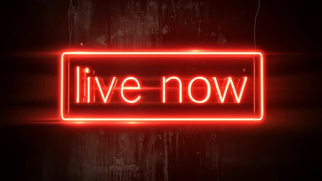 Neon sign that says Live Now. It is red and glowing. The sign is on a wall