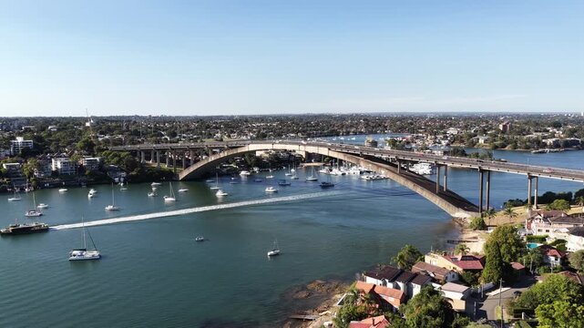 Rivercat passenger ferry on Parramatta river by Gladesville bridge in Sydney aerial view.