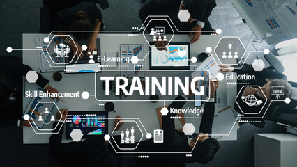 A dynamic collaborative training session showcasing professionals engaging with digital tools for skill enhancement, e-learning, and knowledge sharing in an innovative workspace. Amity