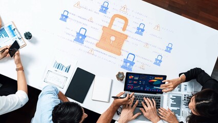 A business meeting focused on cybersecurity strategies, featuring professionals analyzing data protection measures, discussing risks, and collaborating on solutions in a modern workspace. Raster