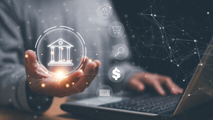 Digital banking and financial technology concept. Hand holding virtual bank icon. Secure online payment, data protection and fintech network. Business finance solution for online transaction.