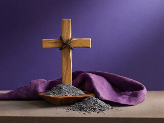 Wooden cross with ashes and purple cloth symbolizing Lent and Ash Wednesday, Christian faith and repentance concept
