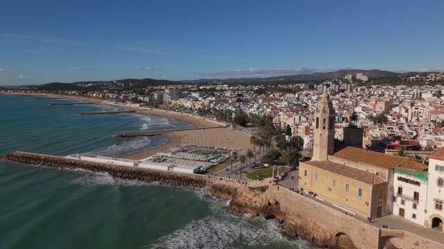 curving around church view of beach in Sitges Spain