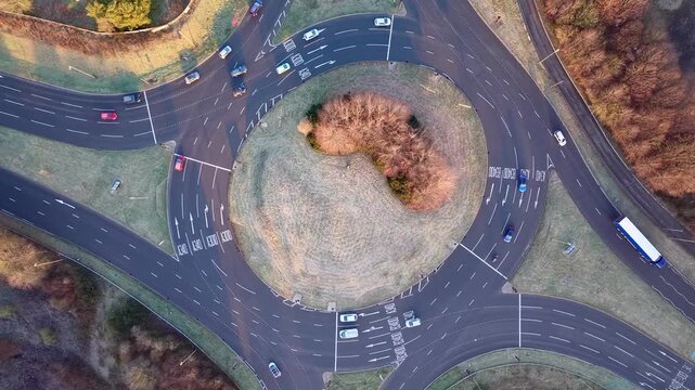 Drone View of Vehicles Moving Through Roundabout in Basingstoke, England
