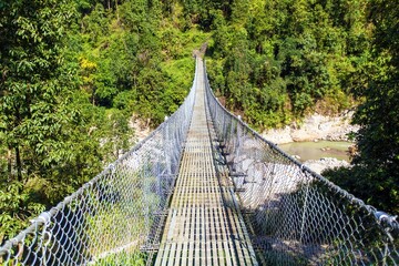 rope hanging suspension bridge in Nepal himalaya