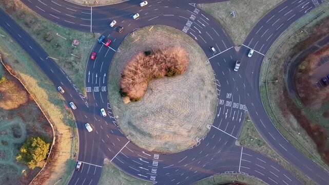 Drone View of Vehicles Moving Through Roundabout in Basingstoke, England