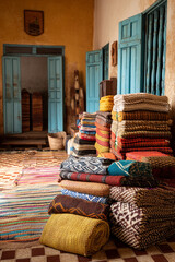 A vibrant Comorian home interior, showcasing traditional woven mats, intricate textiles, and simple, authentic furnishings.