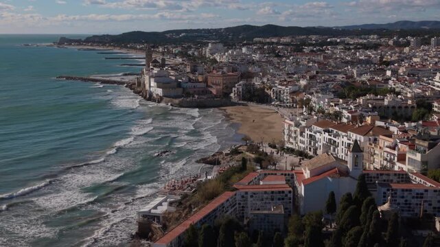 descending aerial view of Sitges Spain