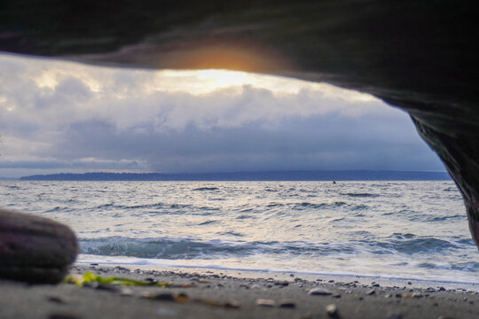 Edmonds Beach under a log into a beautiful view