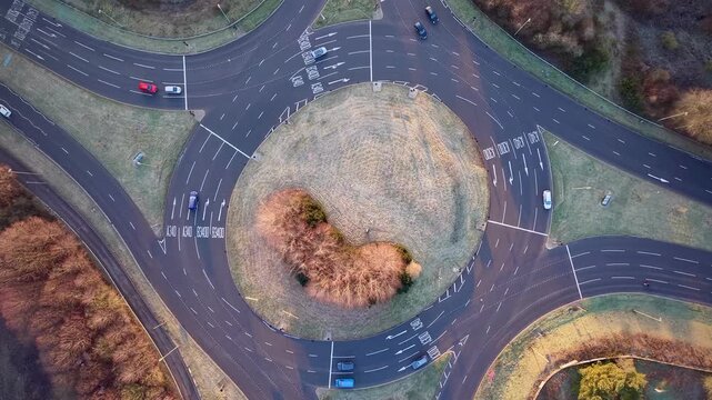 Drone View of Vehicles Moving Through Roundabout in Basingstoke, England