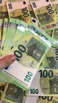 Counting euro banknotes. Female hands count 100 euros cash. Investments, family budget and savings concept