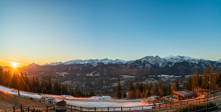 Tatry mountains at sunrise seen from Gubalowka hill in Zakopane. Poland - Powered by Adobe