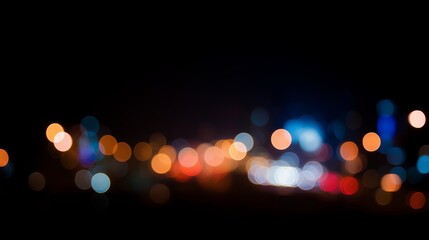 Vibrant colorful bokeh circles from city traffic lights shine through the dark night