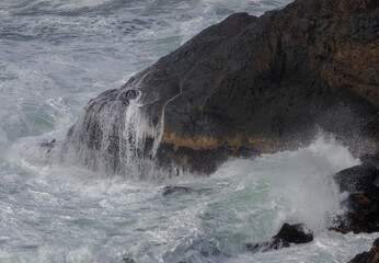 Breaking Wave Crashes into a Rock Along the Oregon Coast