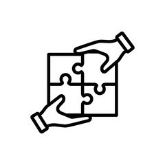 Hands Assembling Jigsaw Puzzle Pieces Together.