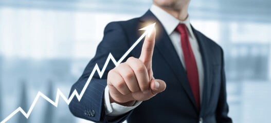 Successful businessman in a suit pointing his finger at a glowing white upward arrow graph, symbolizing financial growth, profit increase, and business achievement
