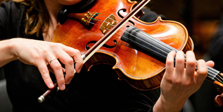 Close-up of a Violinist Playing a Dark Wooden Violin