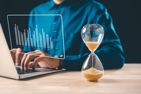 Hourglass time glass hour sand clock concept displays business urgency deadline, person optimizing growth goals on laptop, analyzing data, timer countdown flowing - Powered by Adobe