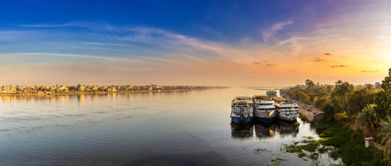 Panorama of Boat on Nile at sunset in a summer evening
