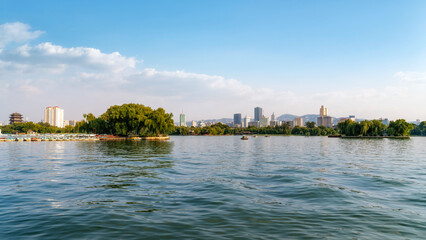 Fototapeta premium Scenic View of Lake with City Skyline