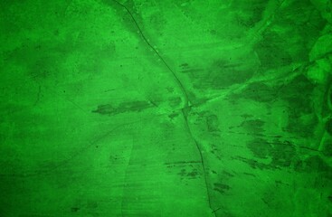 Vivid, textured green surface with pronounced cracks creates a bold abstract backdrop. Ideal for nature-inspired, eco-friendly, or modern design projects needing a striking green texture.