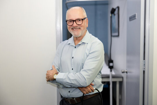 Doctor standing in doorway of office