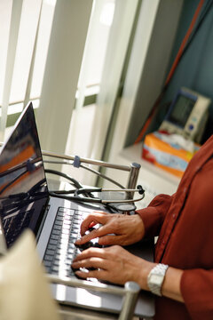 Female doctor typing on the laptop for documentation