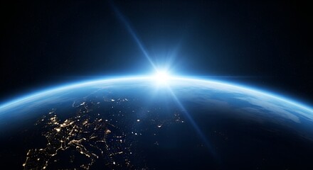 Sunrise over Earth from space showing city lights