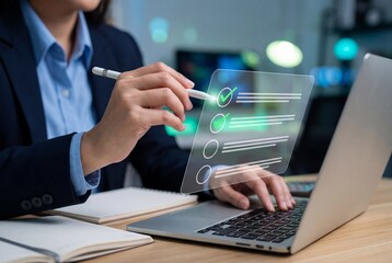 Woman completing an online survey with a stylus on a laptop computer