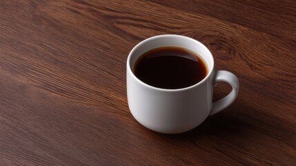 Obraz premium White Ceramic Coffee Mug Filled with Dark Brewed Coffee on Wooden Table Surface for Relaxing Morning or Cozy Afternoon Enjoyment