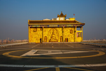 Golden Buddha Hall and helipad on the rooftop of Changsha Baijiali Hotel, China