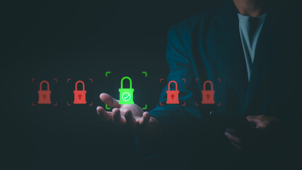 Businessman choosing green padlock icon among red locks. Concept of cyber security, data protection, privacy safety, professional insurance, and selecting secure digital solutions.