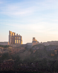 Obraz premium Tynemouth Priory and Castle, in strong low winter sunshine, January 2026