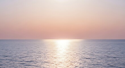 Tranquil ocean horizon bathed in soft sunlight against a pastel sky backdrop