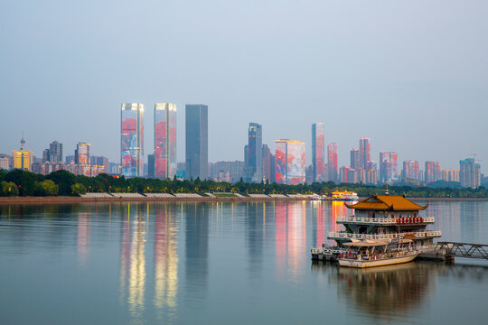 Changsha riverside city skyline night view landscape and cruise ship, China