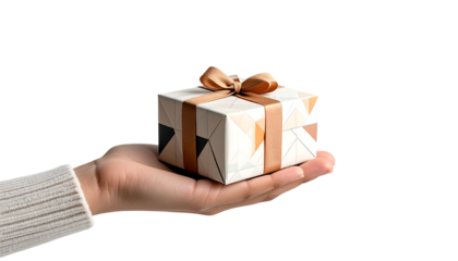 Minimalist shot of a hand giving a decorative present with an elegant bow.