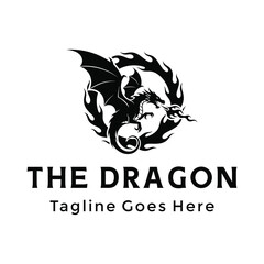 Obraz premium Silhouette Flying dragon with widespread wings breathing fire for brand gaming or fantasy mystery logo design