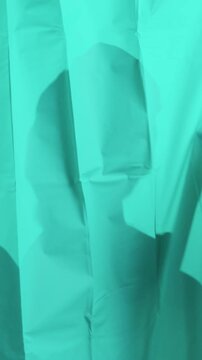 Man hides behind shower curtain with funny face, Energetic soap splash as man peeks playfully behind curtain