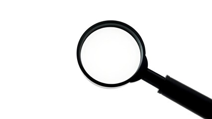 A magnifying glass on a white surface showing lens distortion.