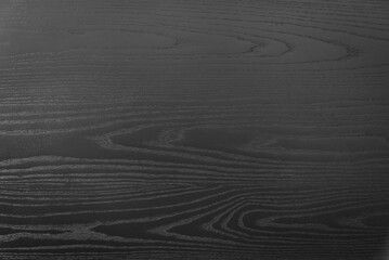 A close up of dark wood grain.