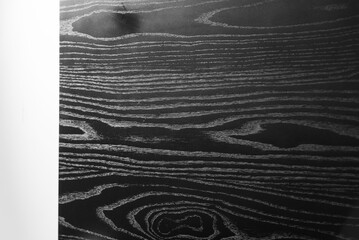 A close up of dark wood grain.