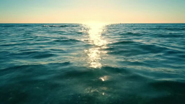 Midday Sun Glare Wide shot of the open ocean with bright, high-noon sun creating powerful, almost abstract reflections across the water's expanse. summer ocean