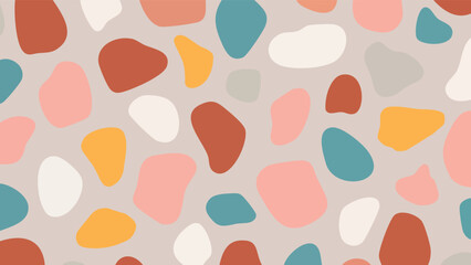 Abstract pattern of colorful, irregular shapes on a soft gray background