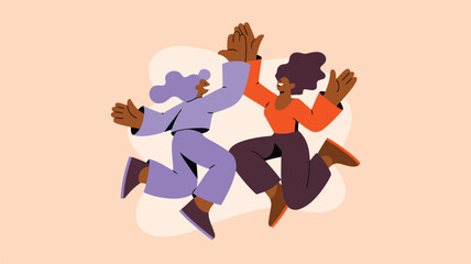 Two smiling diverse people jump and high five together demonstrating unity and cooperation