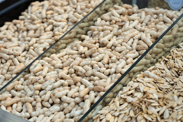 A side view of a dried fruit stall at a market in Xinjiang.