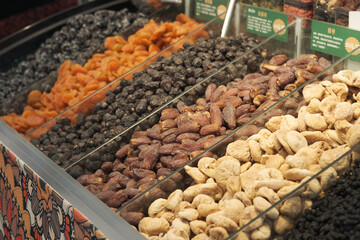A side view of a dried fruit stall at a market in Xinjiang.