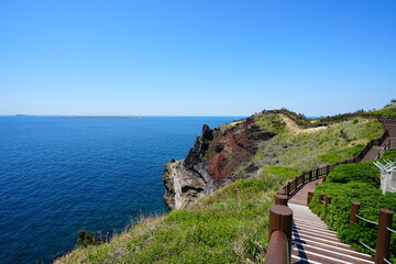 fine walkway at seaside cliff and far islands