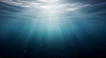 Fototapeta premium Underwater scene with sunbeams and bubbles in deep blue ocean