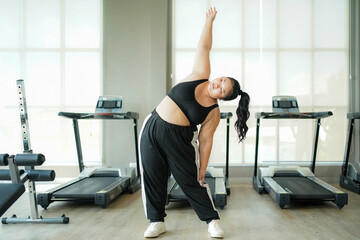 Healthy fat women.  Asian woman fitness exercise for lose weight.  People overweight training and exercising sport in the gym for body healthy.   Healthy Lifestyle Concept