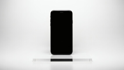 Sleek black smartphone device with a blank, reflective screen standing vertically on a minimalist white surface, symbolizing modern communication and digital connectivity
